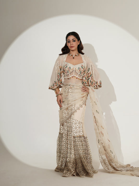 Beige lehenga set showing printed blouse and cape detail
