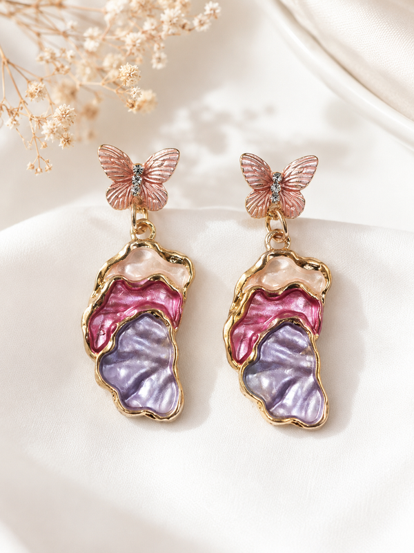 Blush butterfly pearl drop earrings, front view