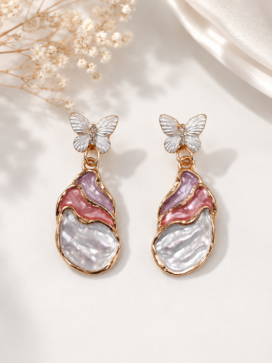Blush butterfly sculptural drop earrings, front view