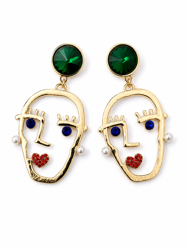 Emerald green face motif statement earrings, front view