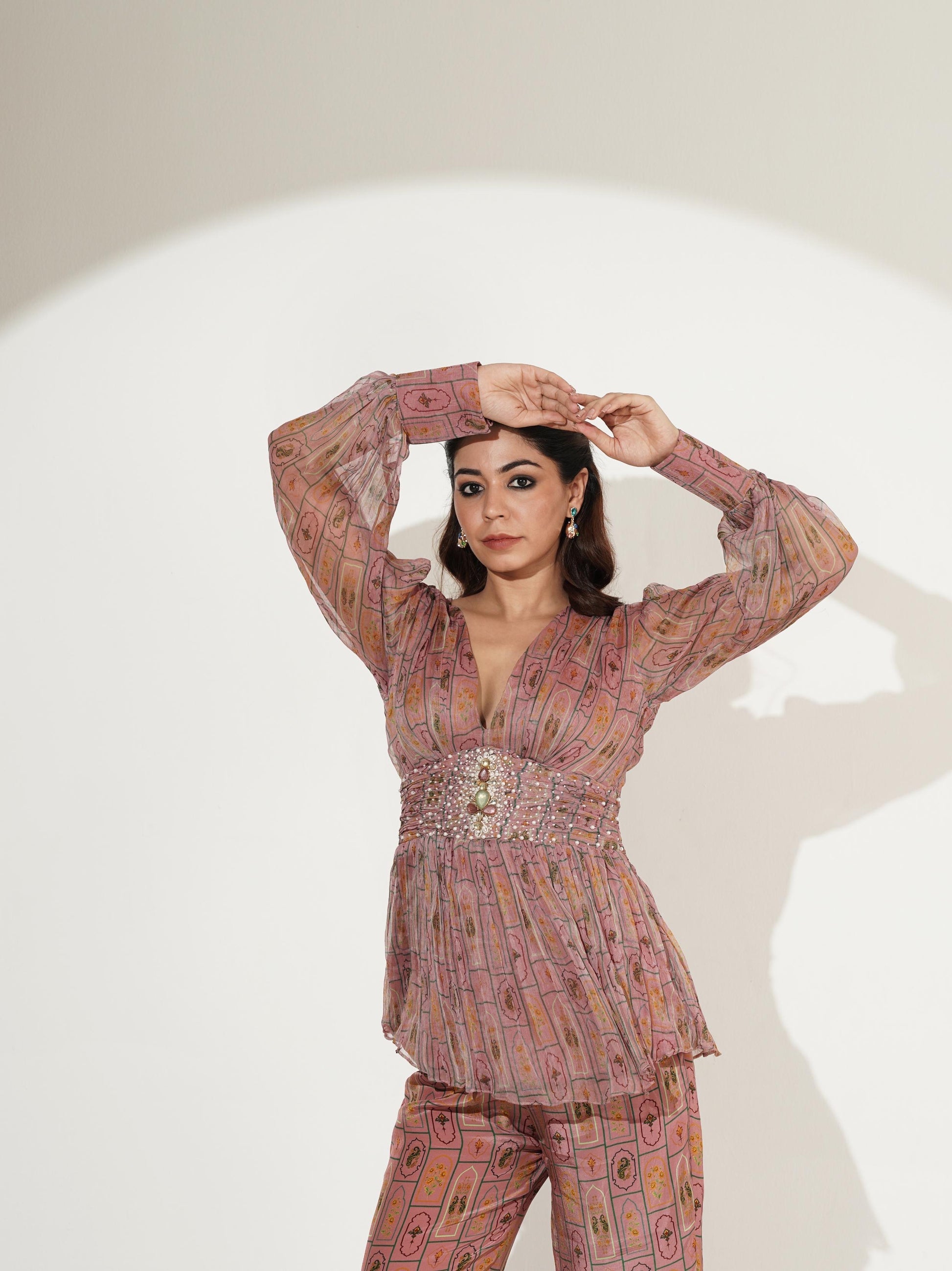 Front view of blush pink embellished peplum co-ord set by Maninder Gulati