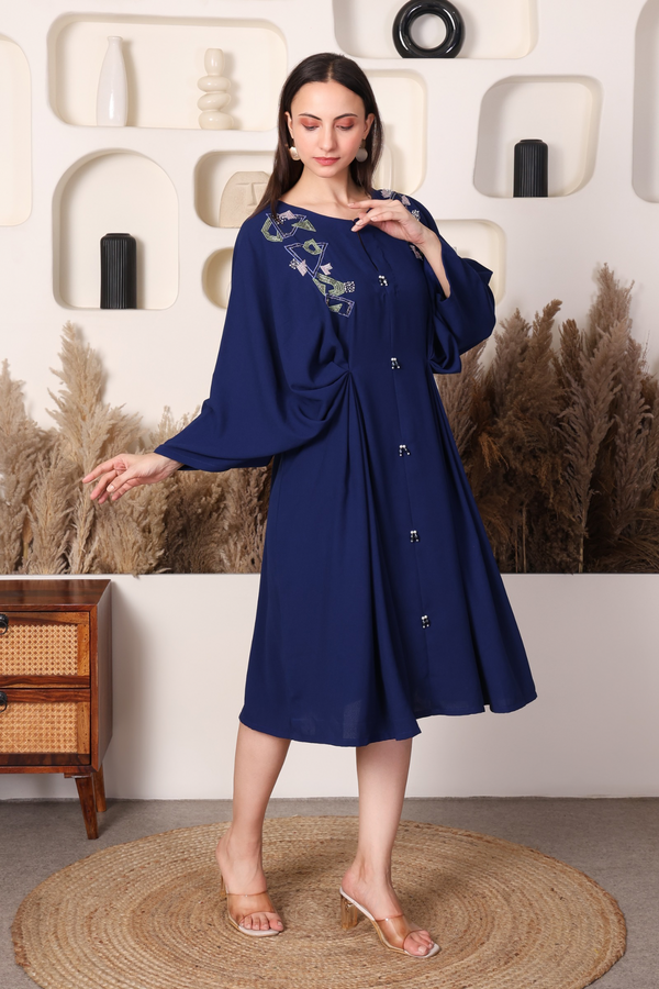 Embroidery detail of navy kaftan dress neckline and sleeves