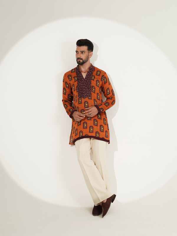 Burnt-orange kurta set showing printed front panel detail