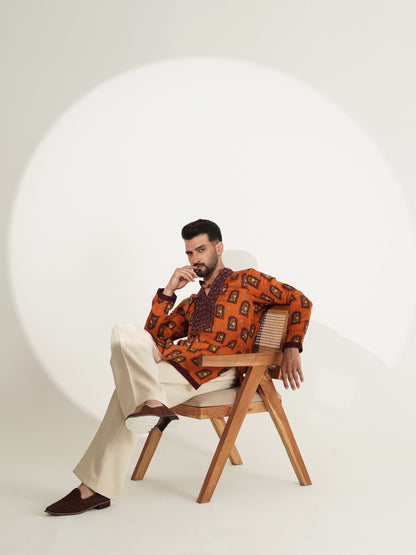 Burnt-orange printed kurta and pyjama set, side view