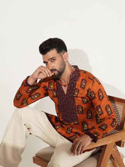 Burnt-orange printed kurta set showing back and patterned hem