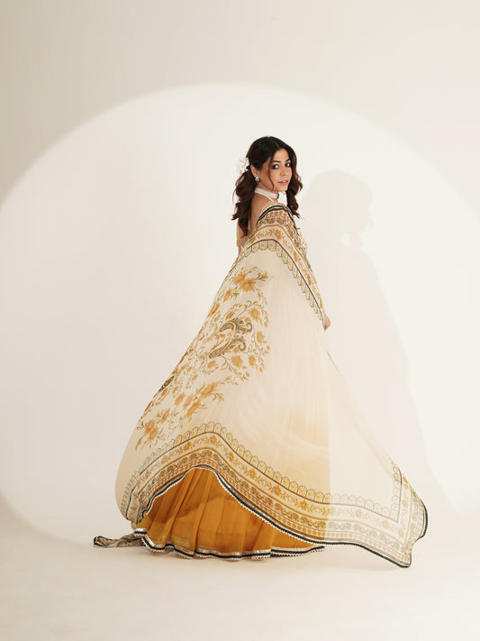 Ivory floral lehenga set showing mustard ombré skirt