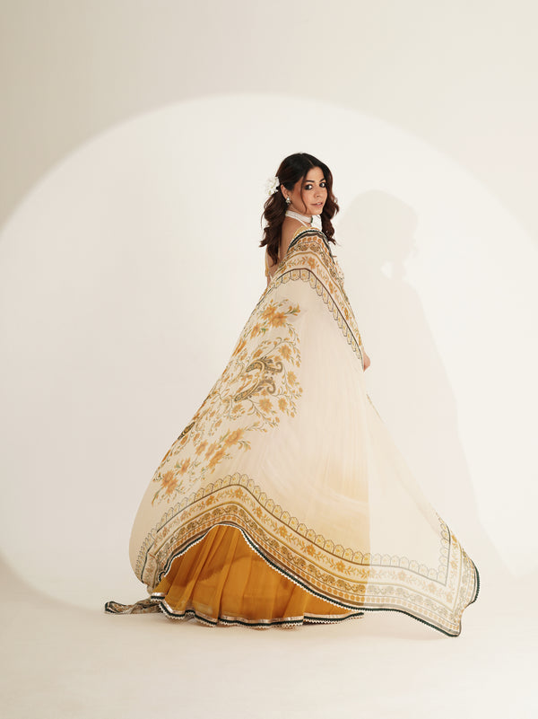 Ivory floral lehenga set showing mustard ombré skirt