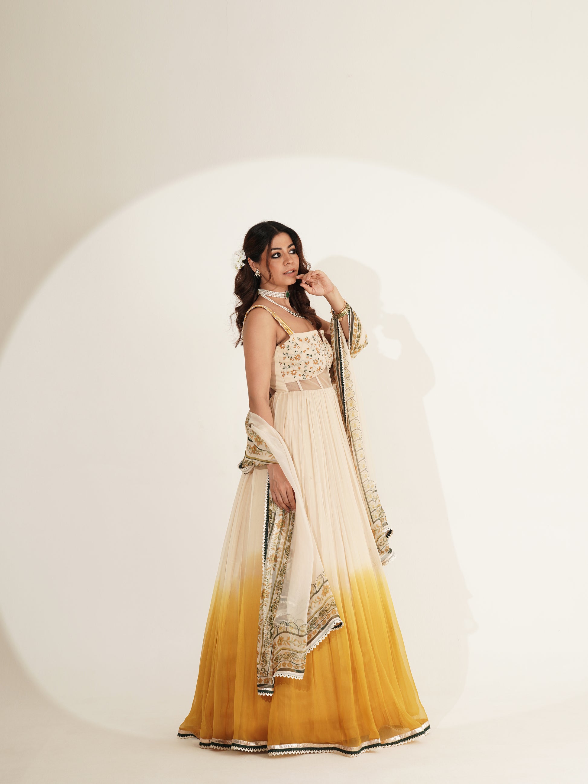 Ivory and mustard lehenga set showing blouse detail