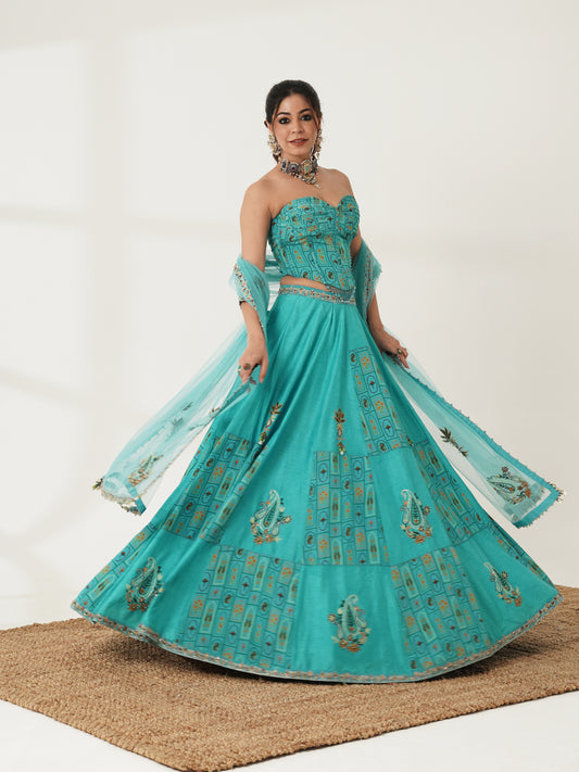 Turquoise printed strapless lehenga set, front view