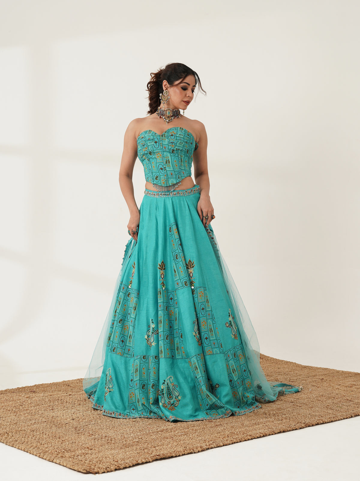 Turquoise printed lehenga set showing embellished dupatta