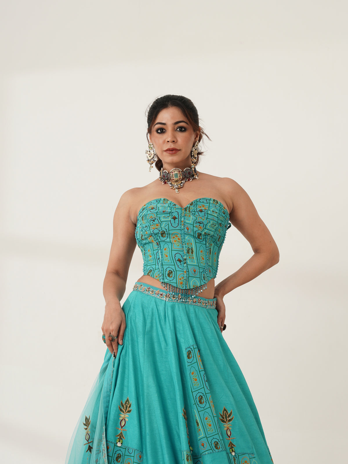 Turquoise strapless lehenga set showing print and blouse detail