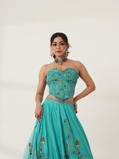 Turquoise strapless lehenga set showing print and blouse detail