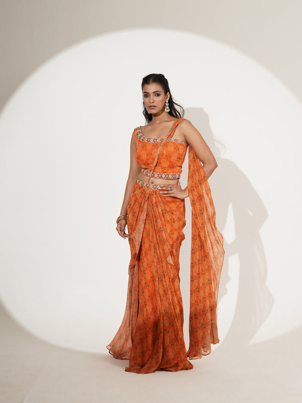 Orange printed one-shoulder draped saree set, front view