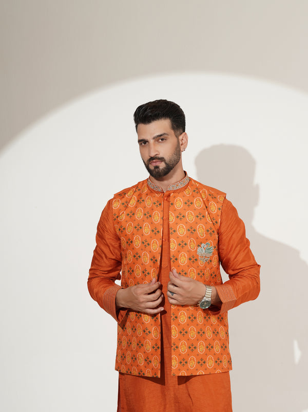 Burnt-orange kurta set showing printed jacket detail