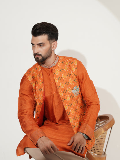 Burnt-orange kurta set showing back of printed jacket