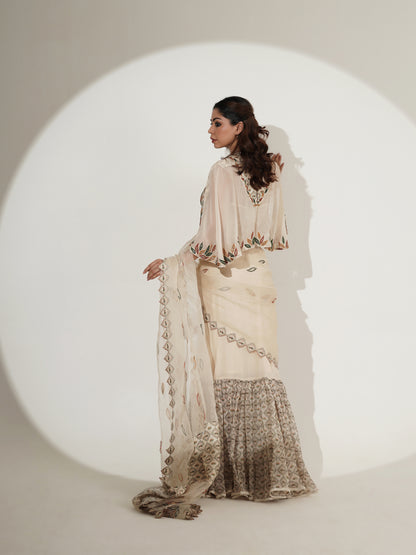 Beige printed lehenga set showing cape and skirt movement