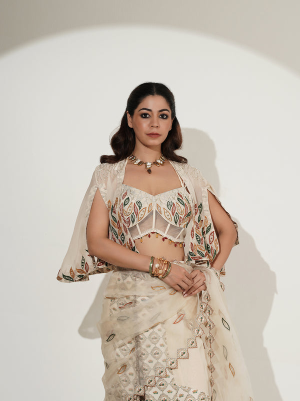 Beige printed lehenga set with sheer cape, front view