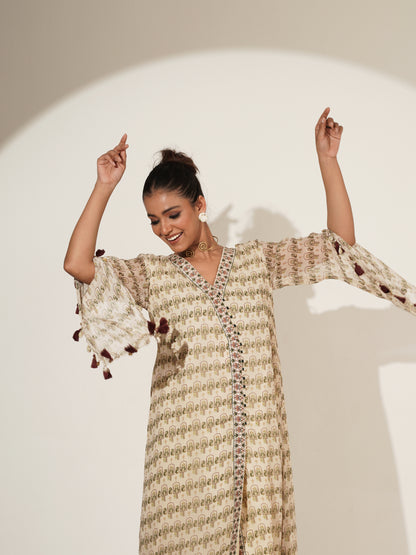 Beige Angrakha suit set showing coordinated printed-hem pants